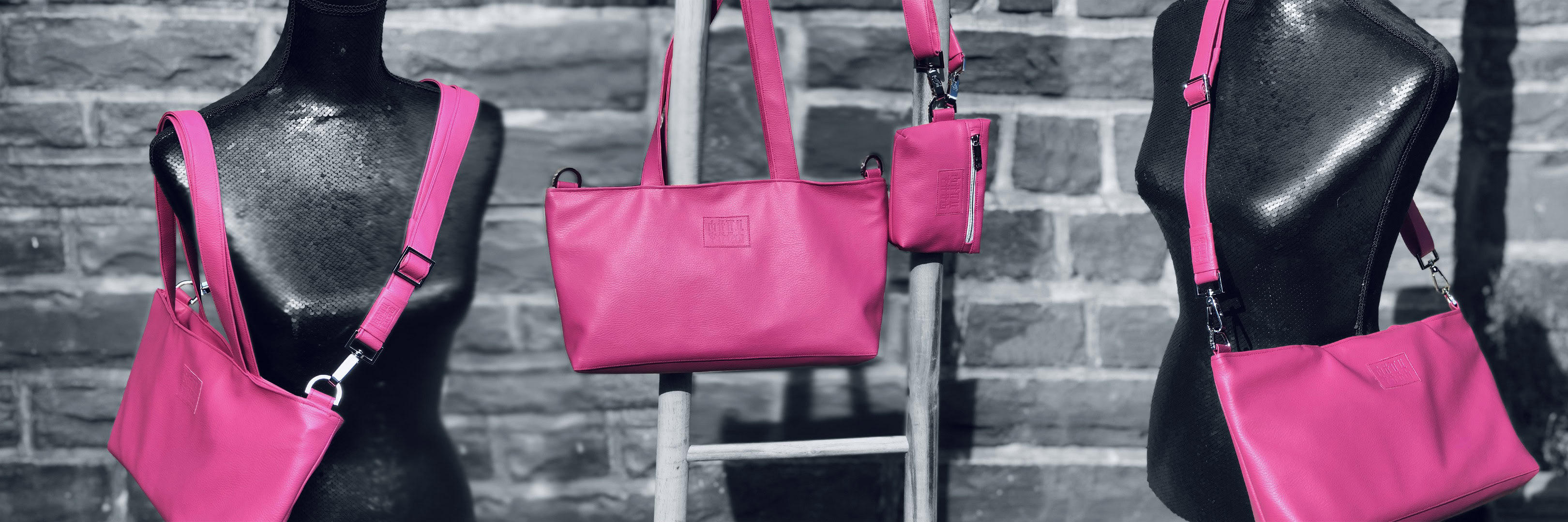 Pink Manufabo Tote Bags in front of wall showcasing different carrying options