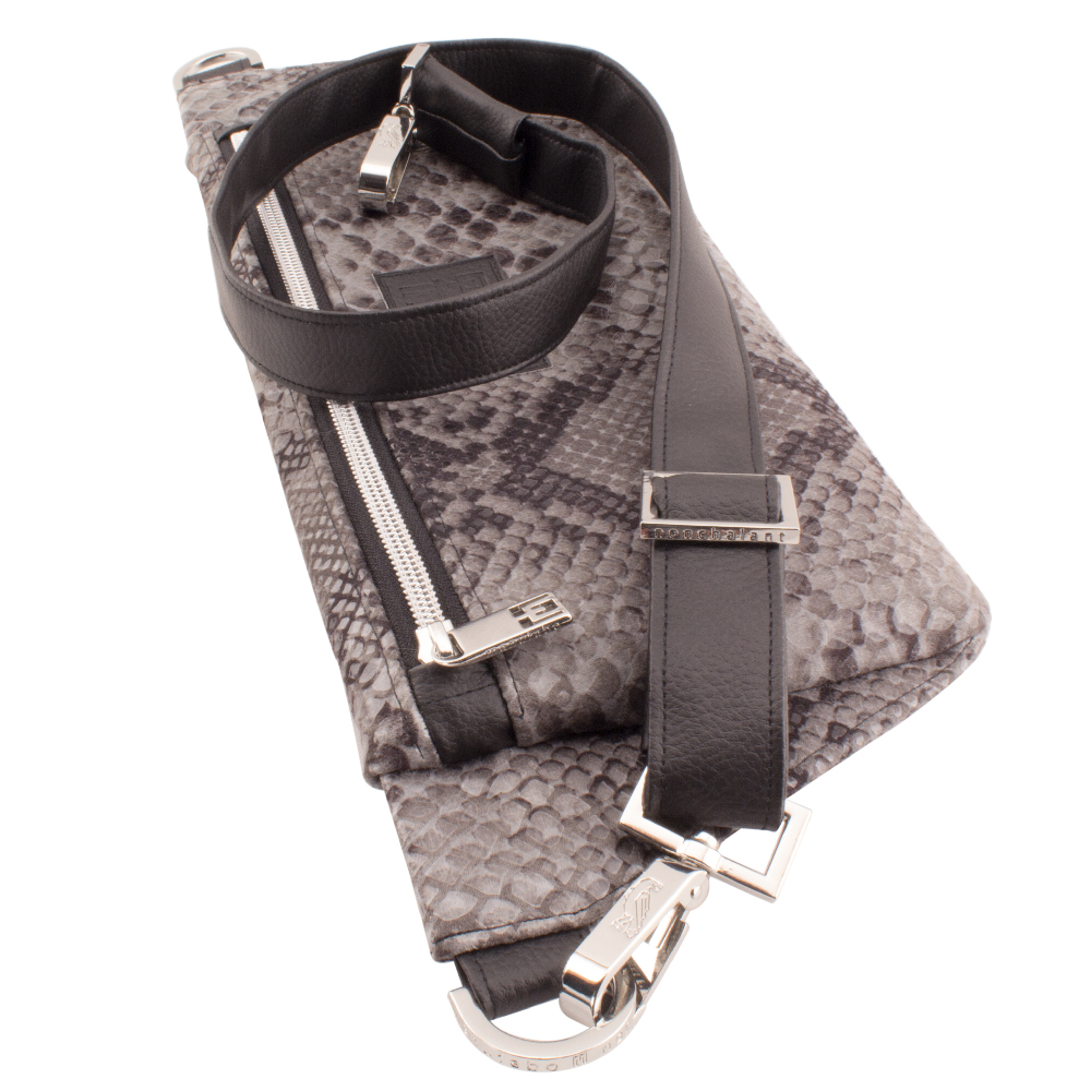 deluxe belt bag lying with handmade strap hardware details faux snake leather