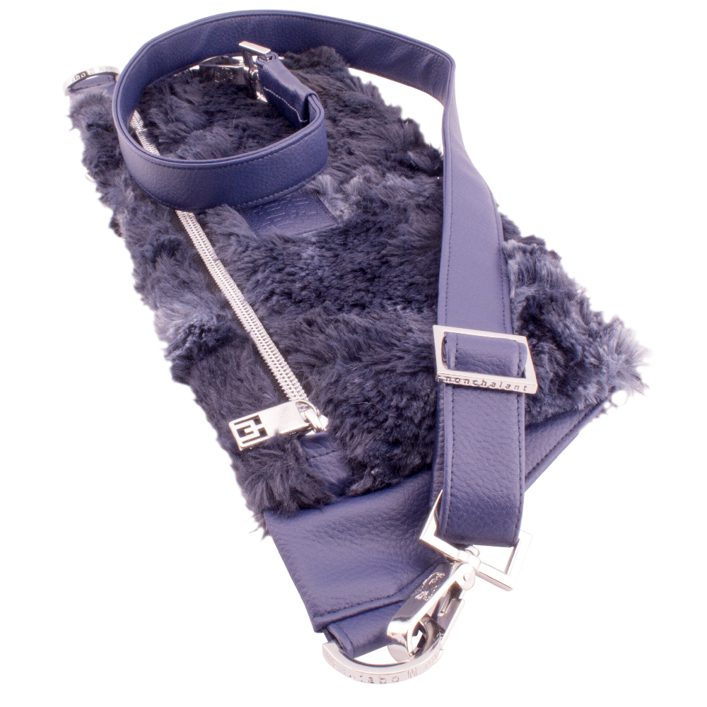 deluxe belt bag lying with handmade strap hardware details plush fluffy blue beast