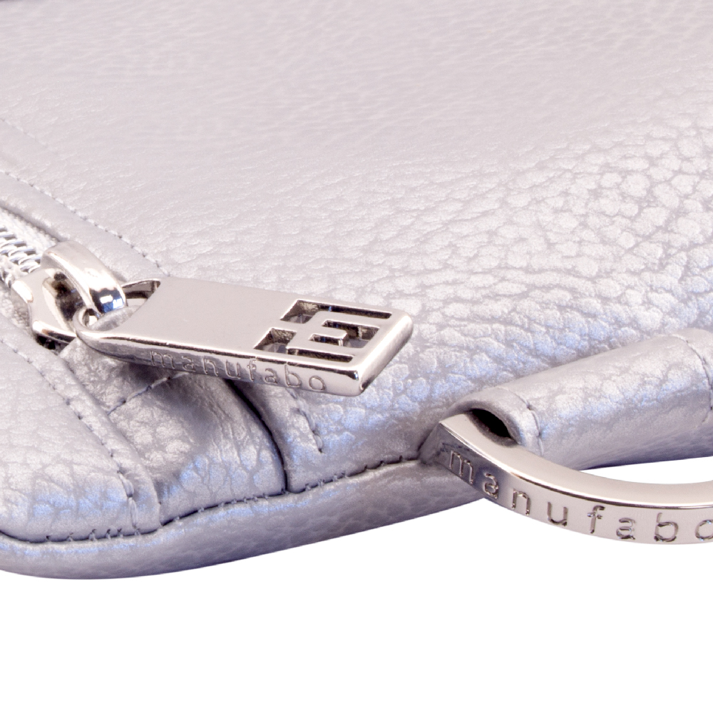 manufabo hardware details zipper and d ring on bag in metallic silver